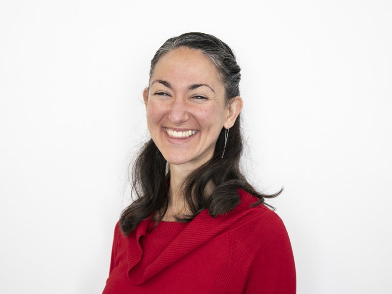 Headshot of Erin Sanchez. female with short brown smiling at the camera wearing red jumper with white background Headshot of Erin Sanchez. female with short brown smiling at the camera wearing red jumper with white background